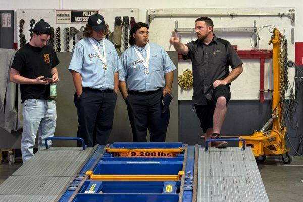 Students and Sikora at Fix Auto